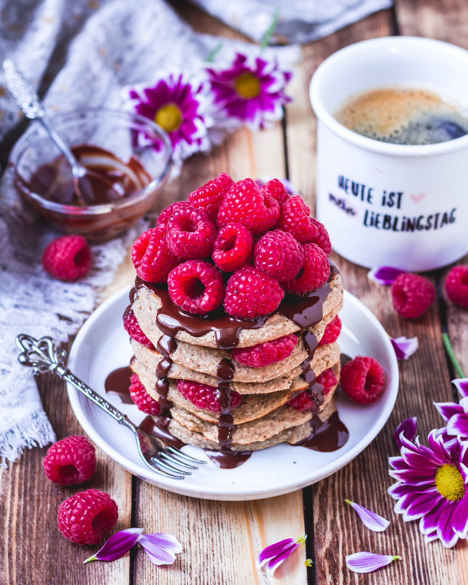 vegan protein pancakes with raspberries and chocolate